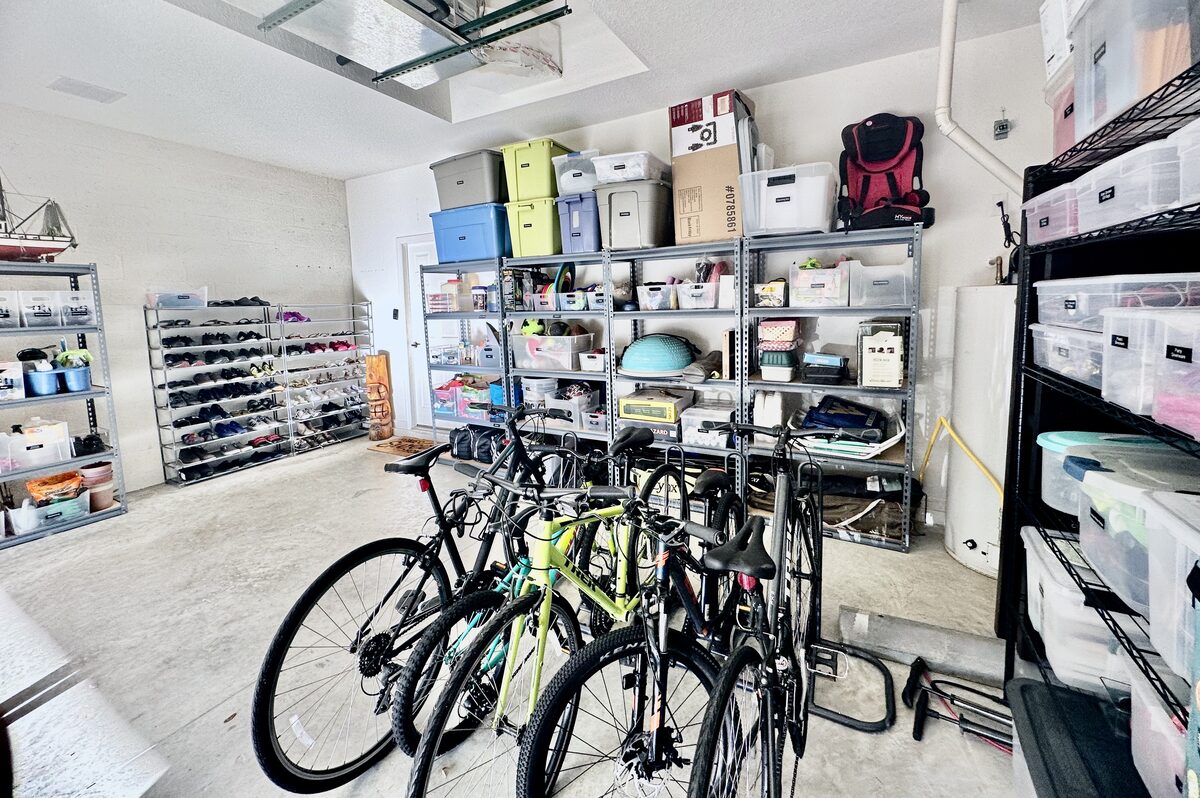 Garage overhaul with wall storage, labeled bins, and reclaimed floor space — Simply Spacial Sarasota home organizer