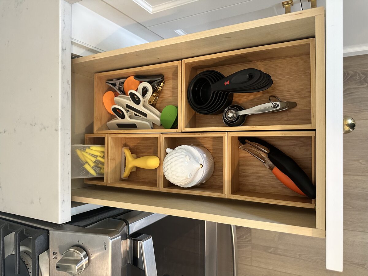 Kitchen utensil drawer with custom divider inserts and grouped functionality — Simply Spacial Sarasota FL