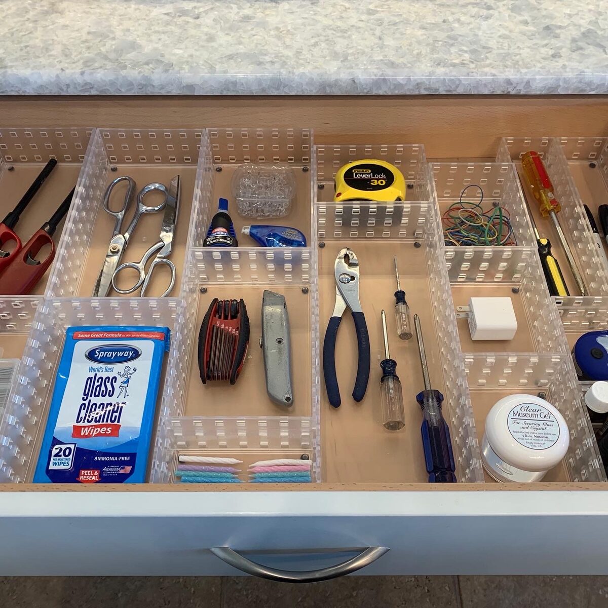 Cluttered junk drawer transformed into a functional organized space — Simply Spacial Sarasota