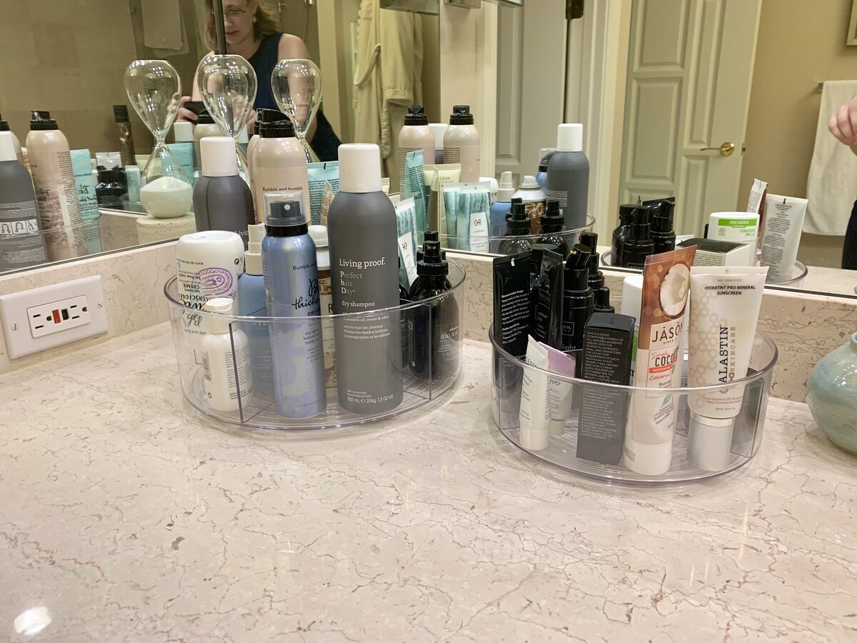 Bathroom vanity counter with sensory-conscious product groupings and clean layout — Simply Spacial Sarasota FL